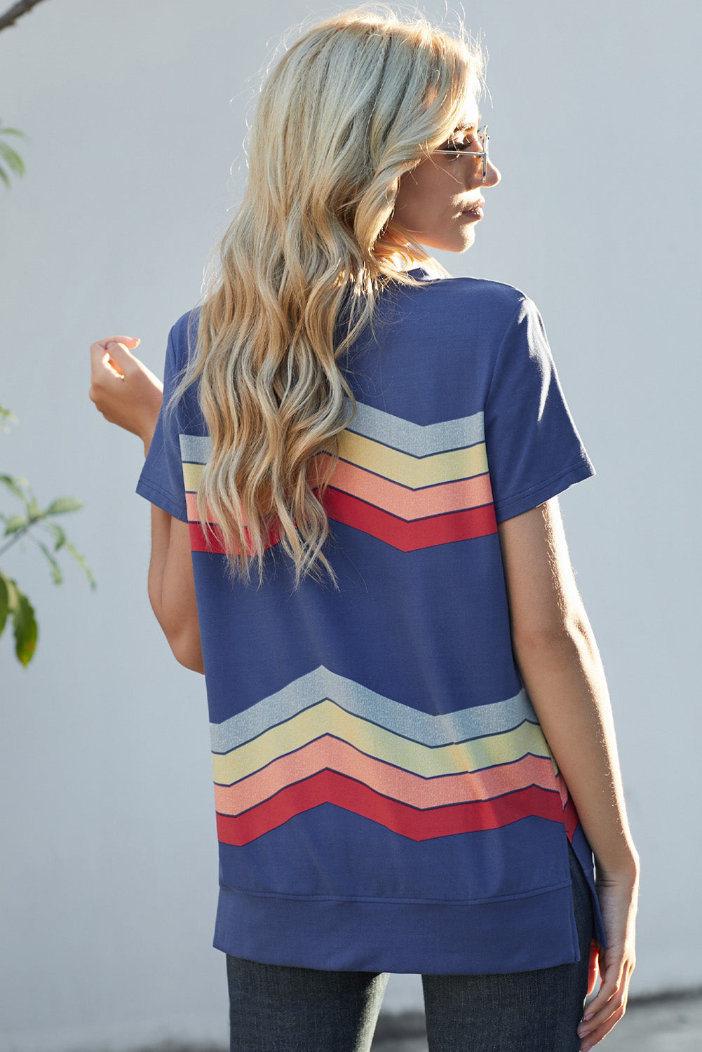 Blue short sleeve tee featuring colorful wavy stripes print, perfect for casual wear.