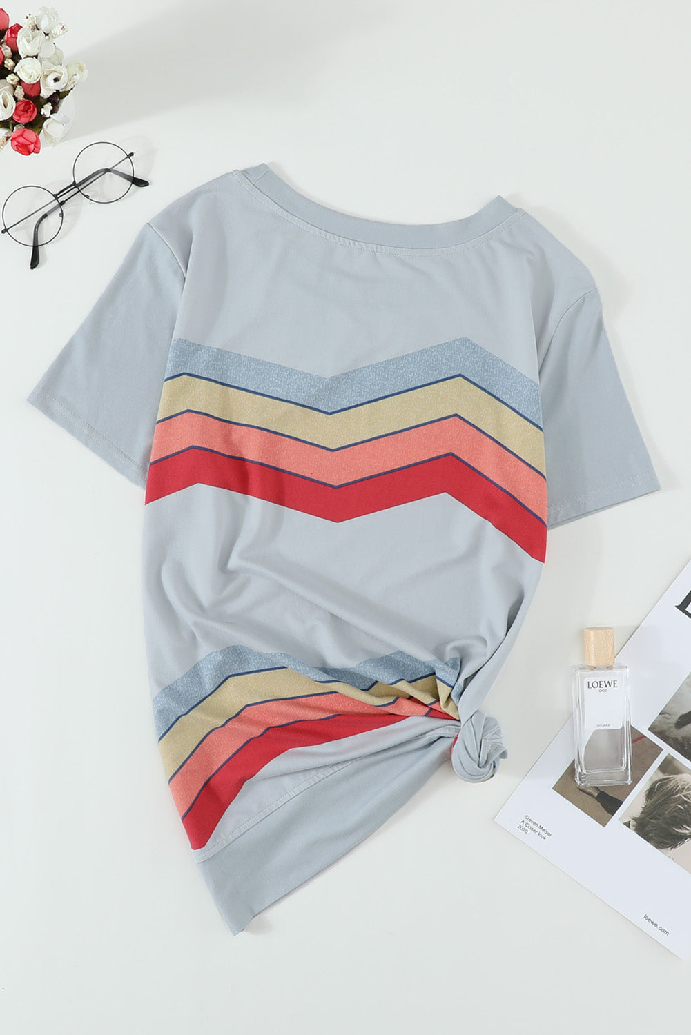 Blue short sleeve tee featuring colorful wavy stripes print, perfect for casual wear.