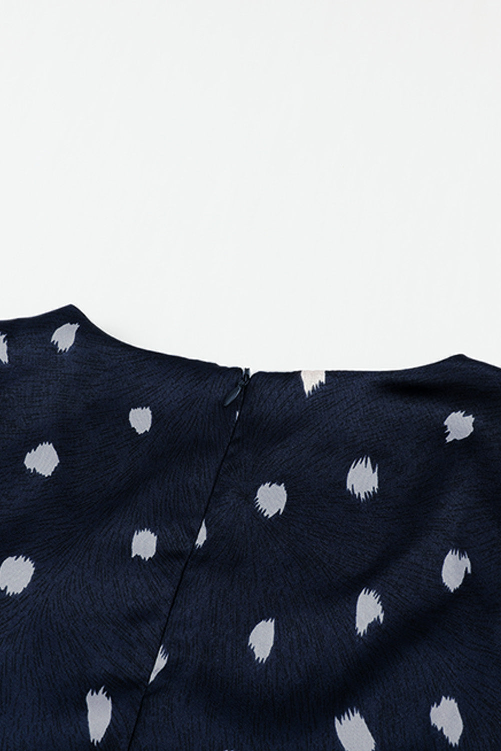 A stylish blue A-line dress featuring a deep V neck, balloon sleeves, and a knotted front with a polka dot print, perfect for various occasions.