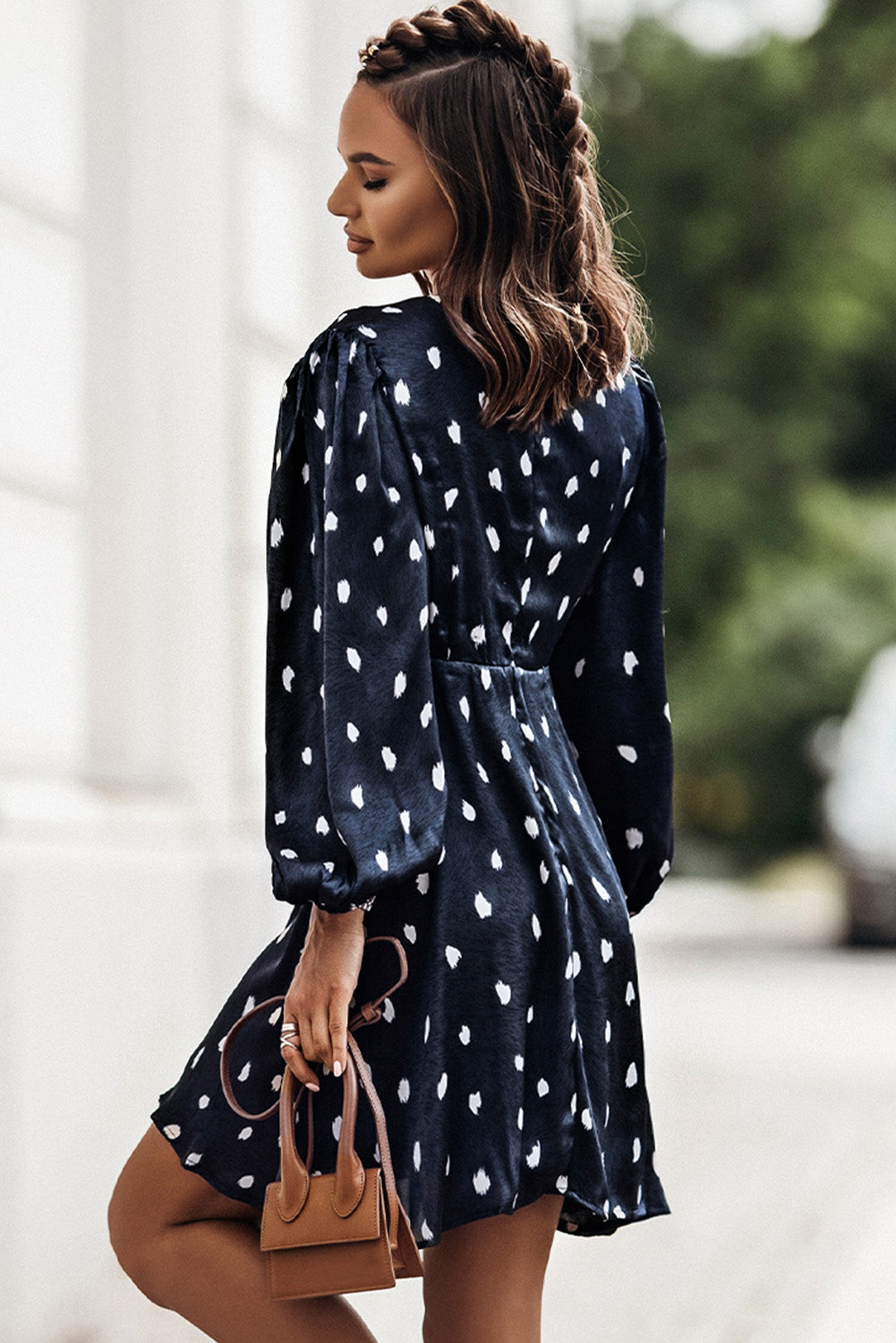 A stylish blue A-line dress featuring a deep V neck, balloon sleeves, and a knotted front with a polka dot print, perfect for various occasions.