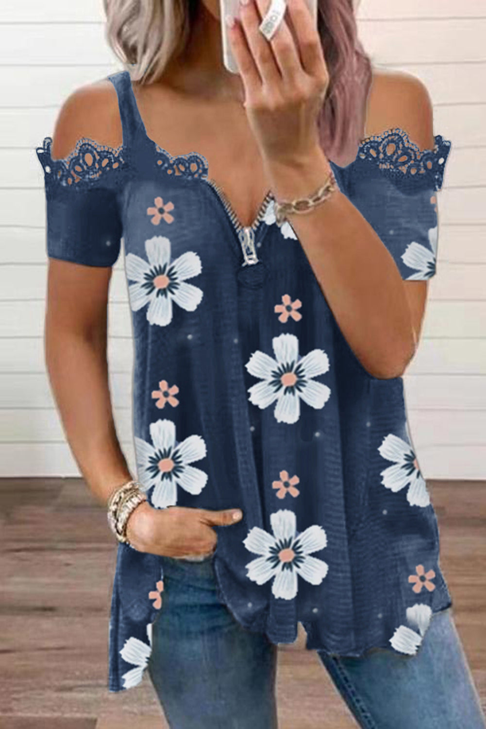 Blue floral print t-shirt with lace contrast and cold shoulder design, featuring a zipped closure for easy wear.