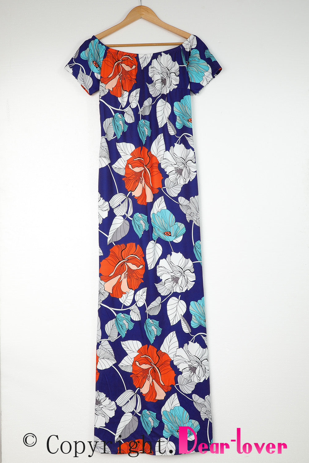 A beautiful plus size maxi dress featuring a blue green floral print and an off-the-shoulder design, perfect for elegant occasions.