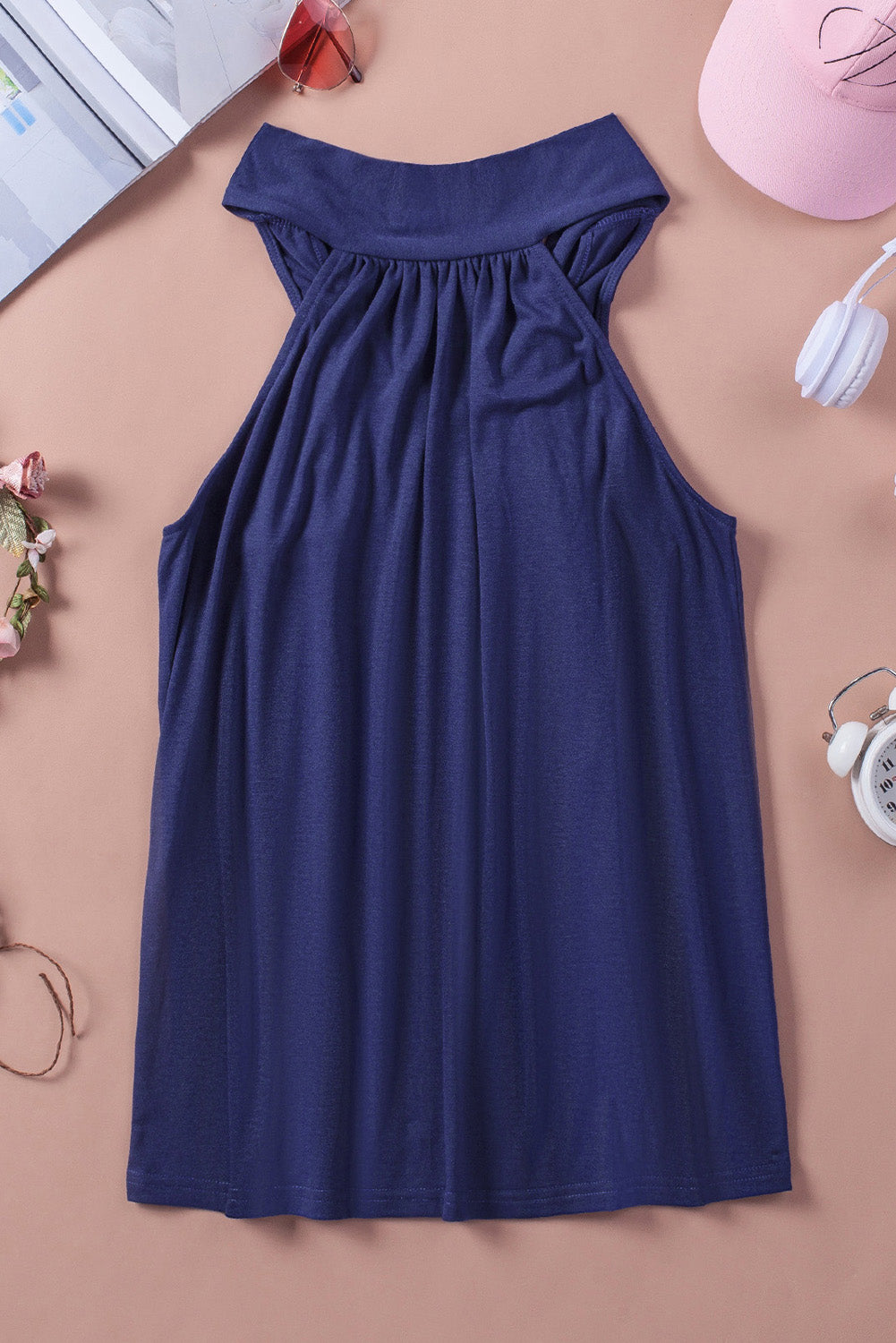 A stylish blue high neck tie tank top with a halter neckline and back tie closure, perfect for versatile styling.