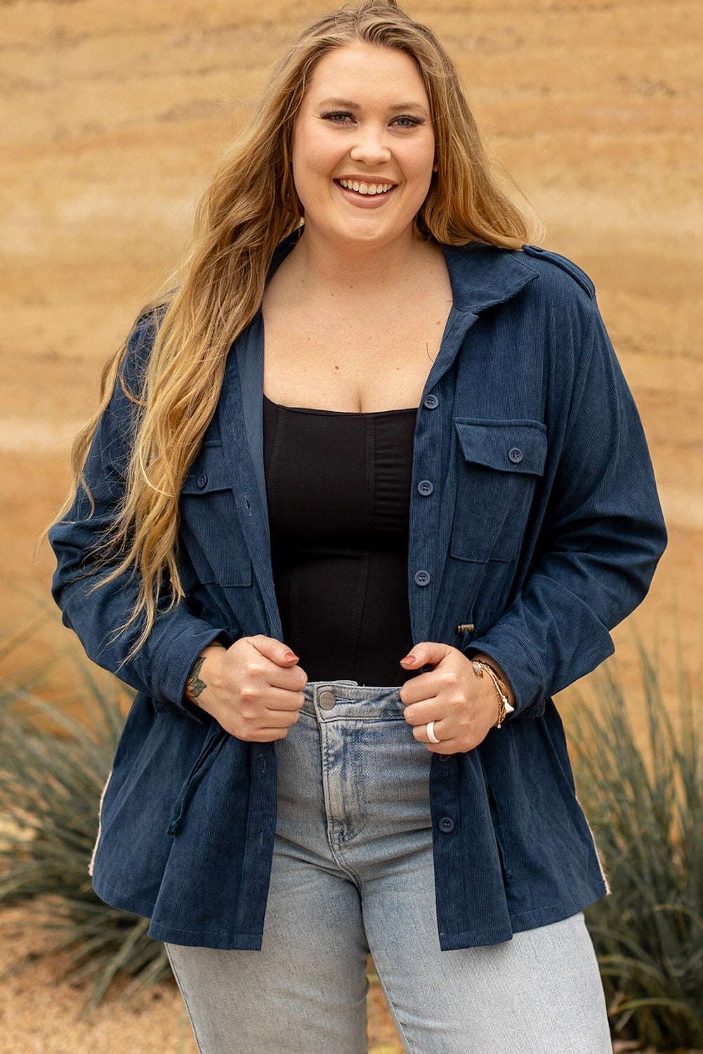 Blue plus size corduroy jacket with Aztec print back, featuring a loose fit, drawstring waist, and flap pockets.