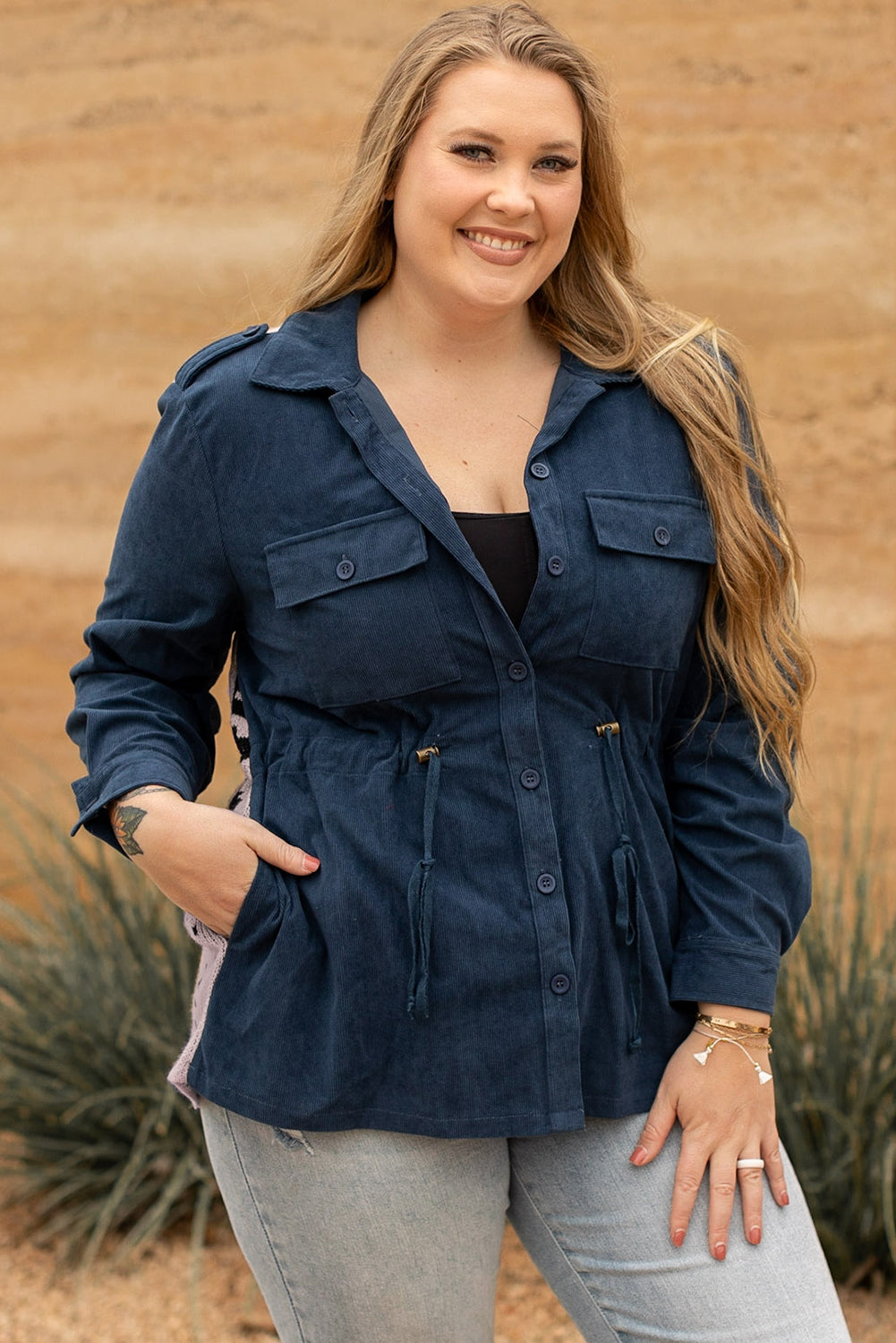 Blue plus size corduroy jacket with Aztec print back, featuring a loose fit, drawstring waist, and flap pockets.