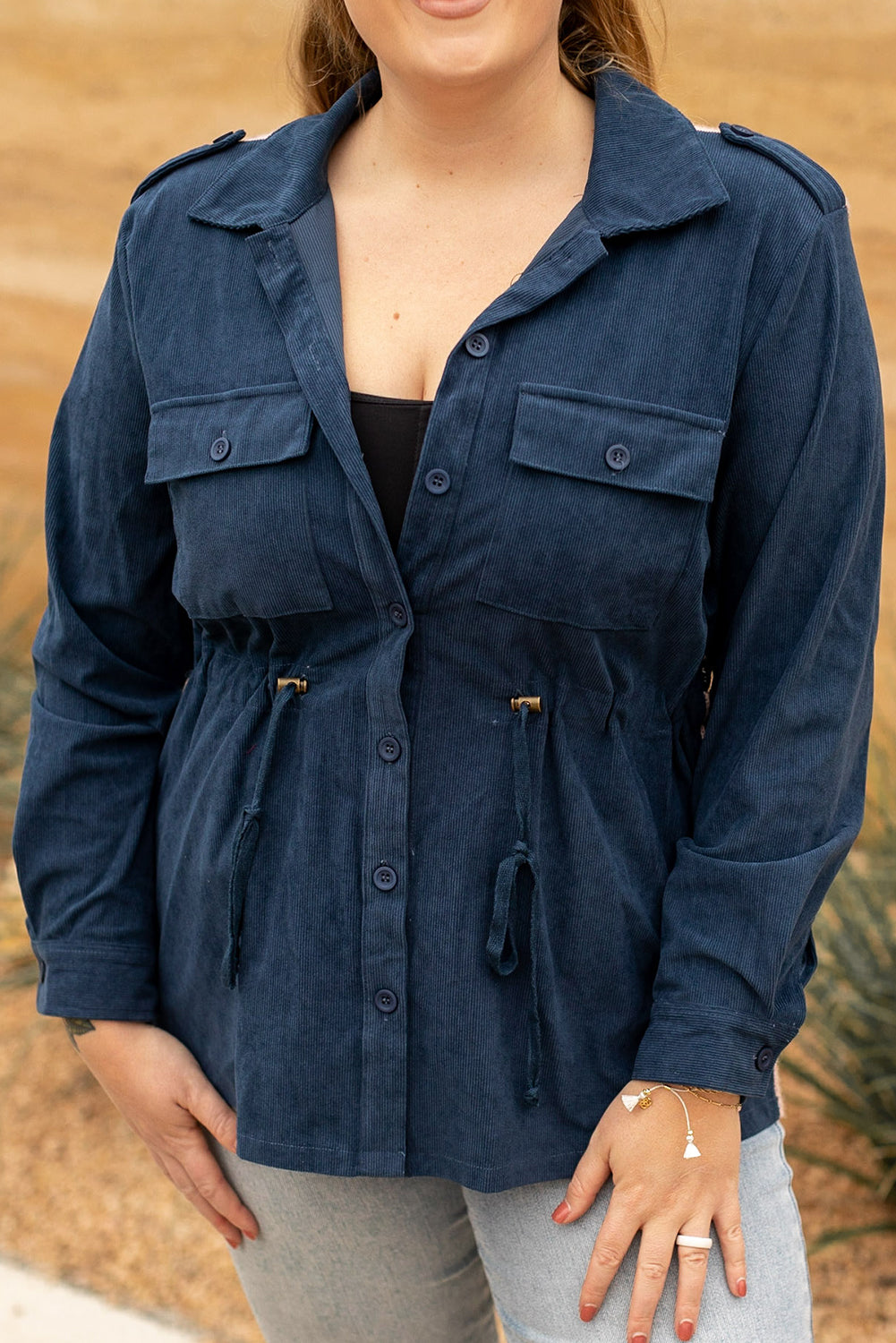 Blue plus size corduroy jacket with Aztec print back, featuring a loose fit, drawstring waist, and flap pockets.