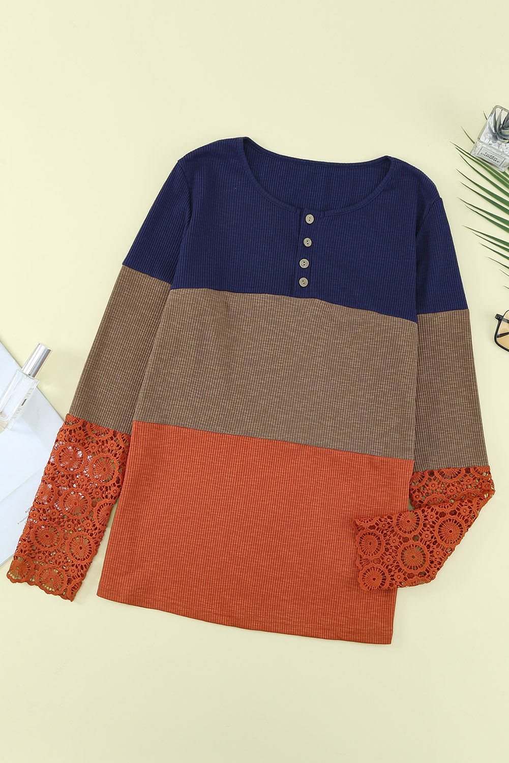 Blue ribbed long sleeve top featuring lace splicing and color block design, perfect for casual and trendy outfits.