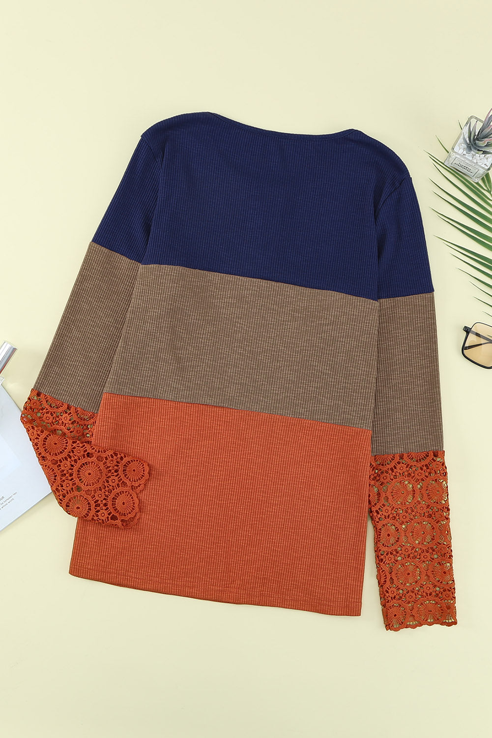 Blue ribbed long sleeve top featuring lace splicing and color block design, perfect for casual and trendy outfits.