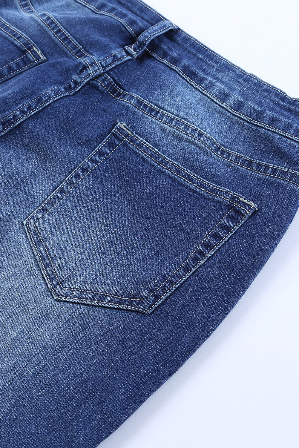 A pair of Blue Western Pattern High Rise Flare Jeans displayed on a white background, showcasing the flared design and high-rise waist.