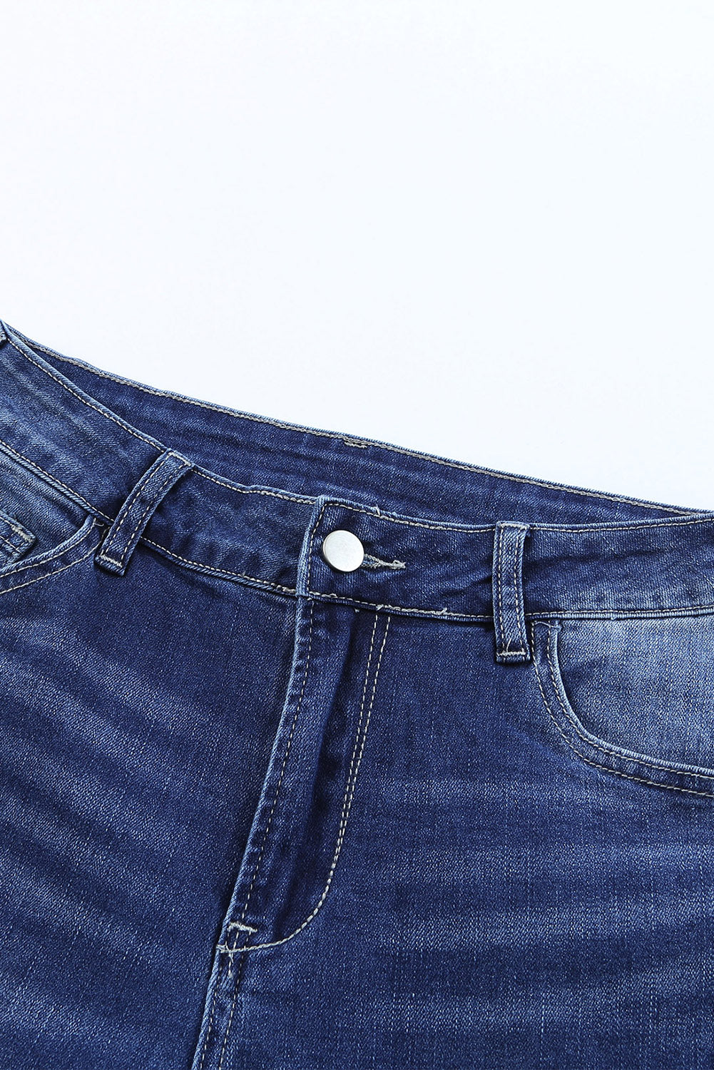 A pair of Blue Western Pattern High Rise Flare Jeans displayed on a white background, showcasing the flared design and high-rise waist.