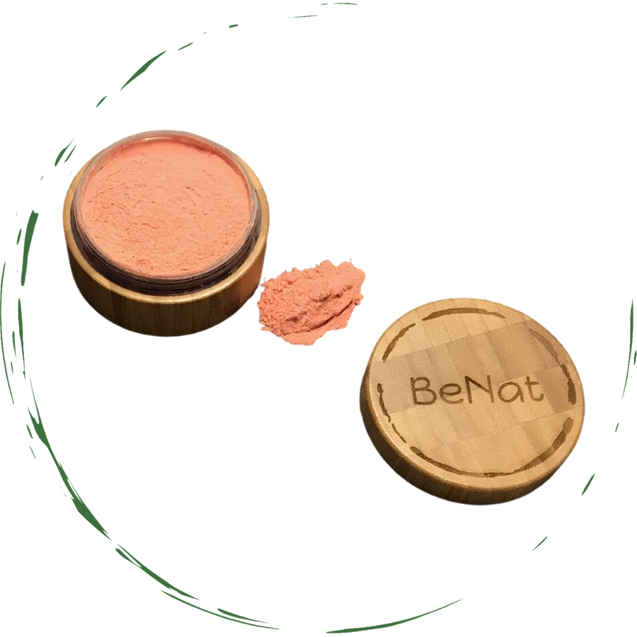 A bamboo container filled with blush loose powder, showcasing its eco-friendly design and natural ingredients.