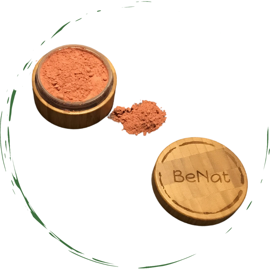 A bamboo container filled with blush loose powder, showcasing its eco-friendly design and natural ingredients.