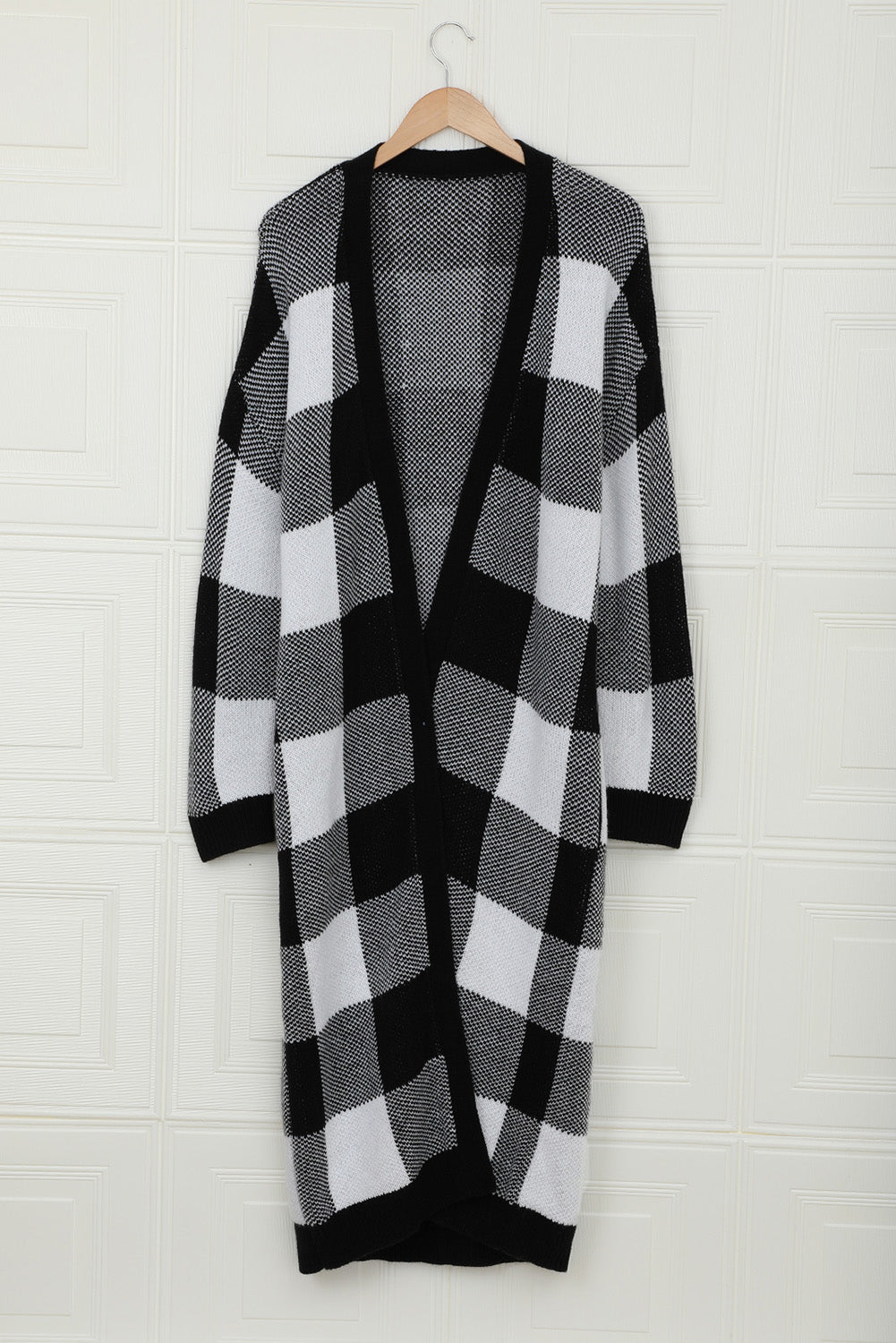 A stylish Board Games Pocketed Checkered Cardigan featuring a monochrome plaid print, open front design, and cozy fabric, perfect for chilly weather.