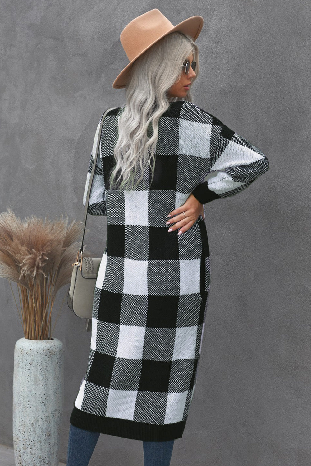 A stylish Board Games Pocketed Checkered Cardigan featuring a monochrome plaid print, open front design, and cozy fabric, perfect for chilly weather.