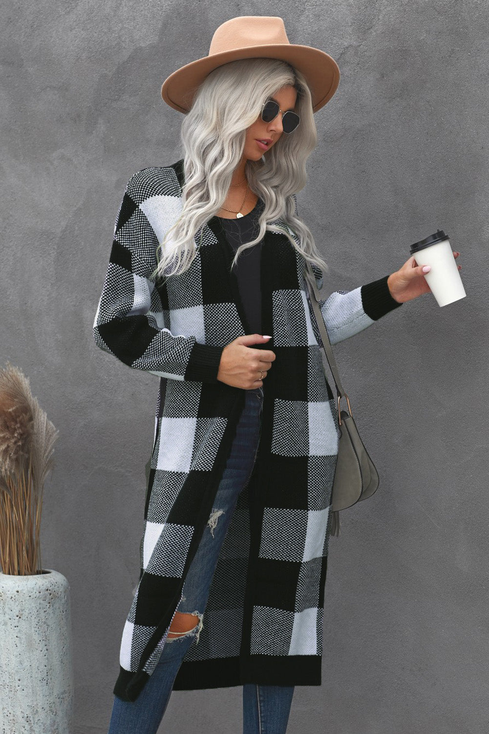 A stylish Board Games Pocketed Checkered Cardigan featuring a monochrome plaid print, open front design, and cozy fabric, perfect for chilly weather.