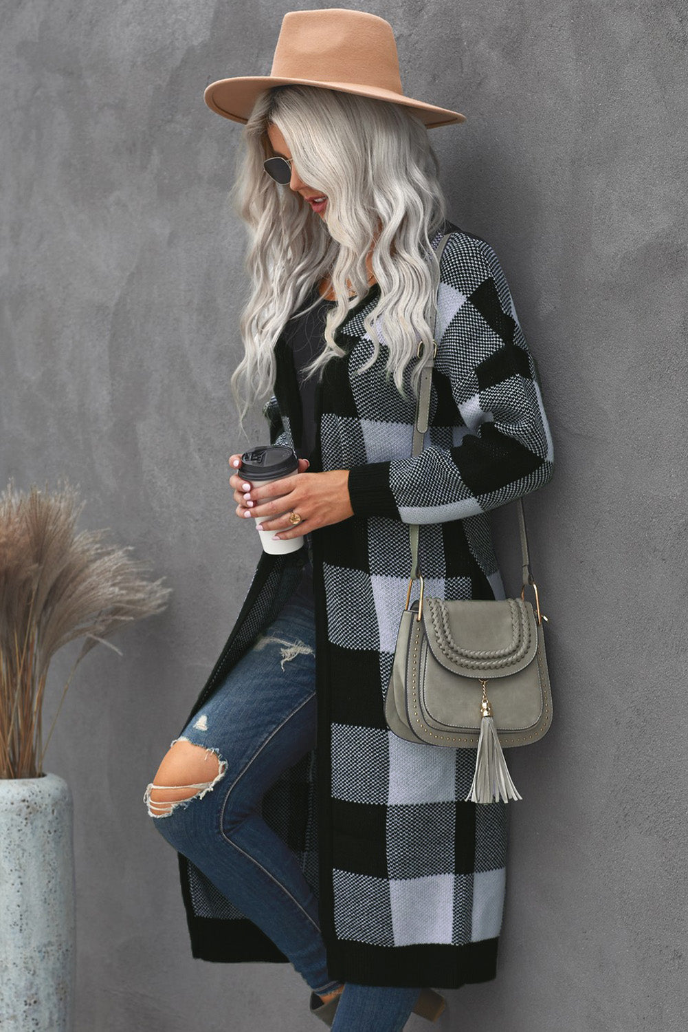 A stylish Board Games Pocketed Checkered Cardigan featuring a monochrome plaid print, open front design, and cozy fabric, perfect for chilly weather.