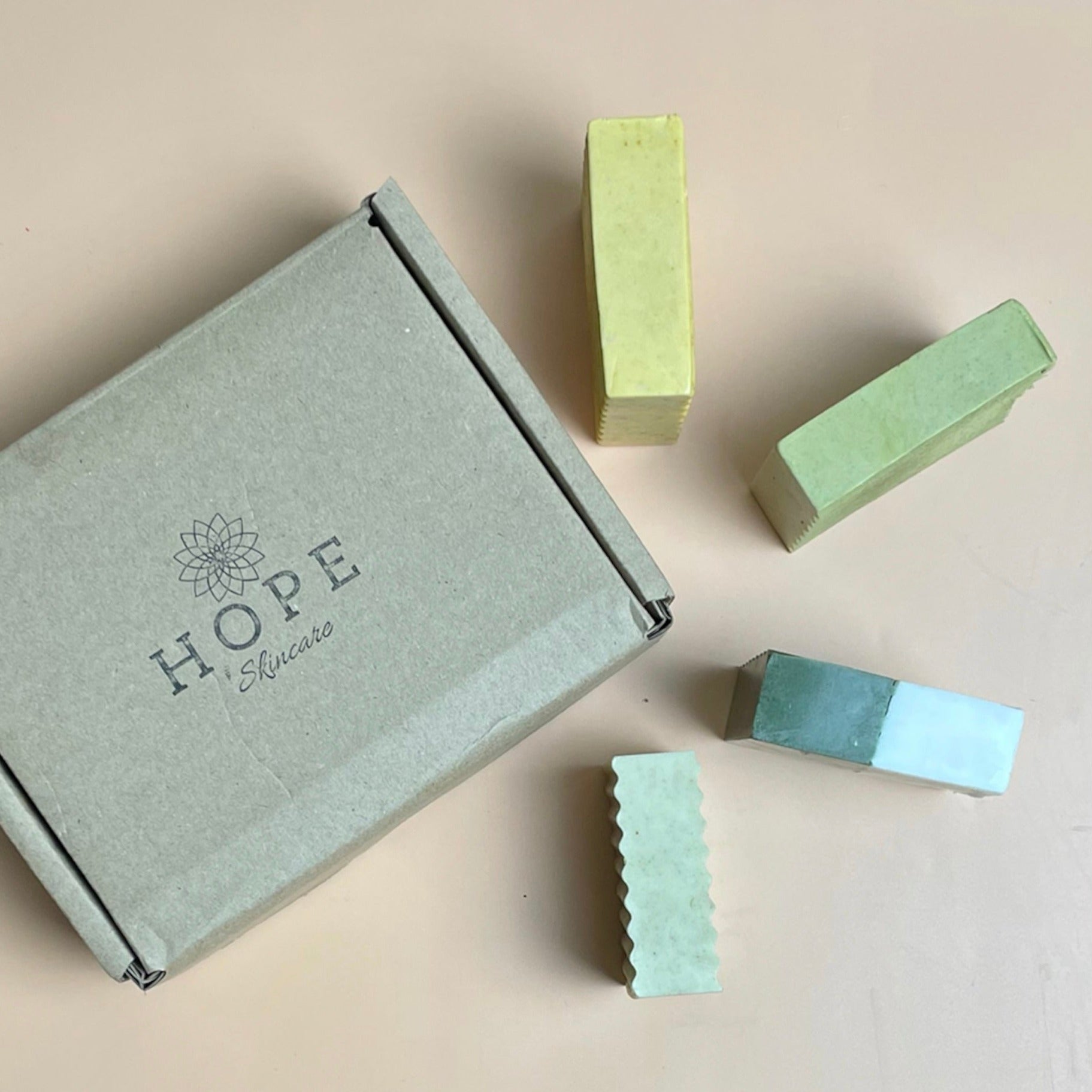 A vibrant four-piece Body Bar Set featuring organic ingredients for healthy skin, displayed elegantly.