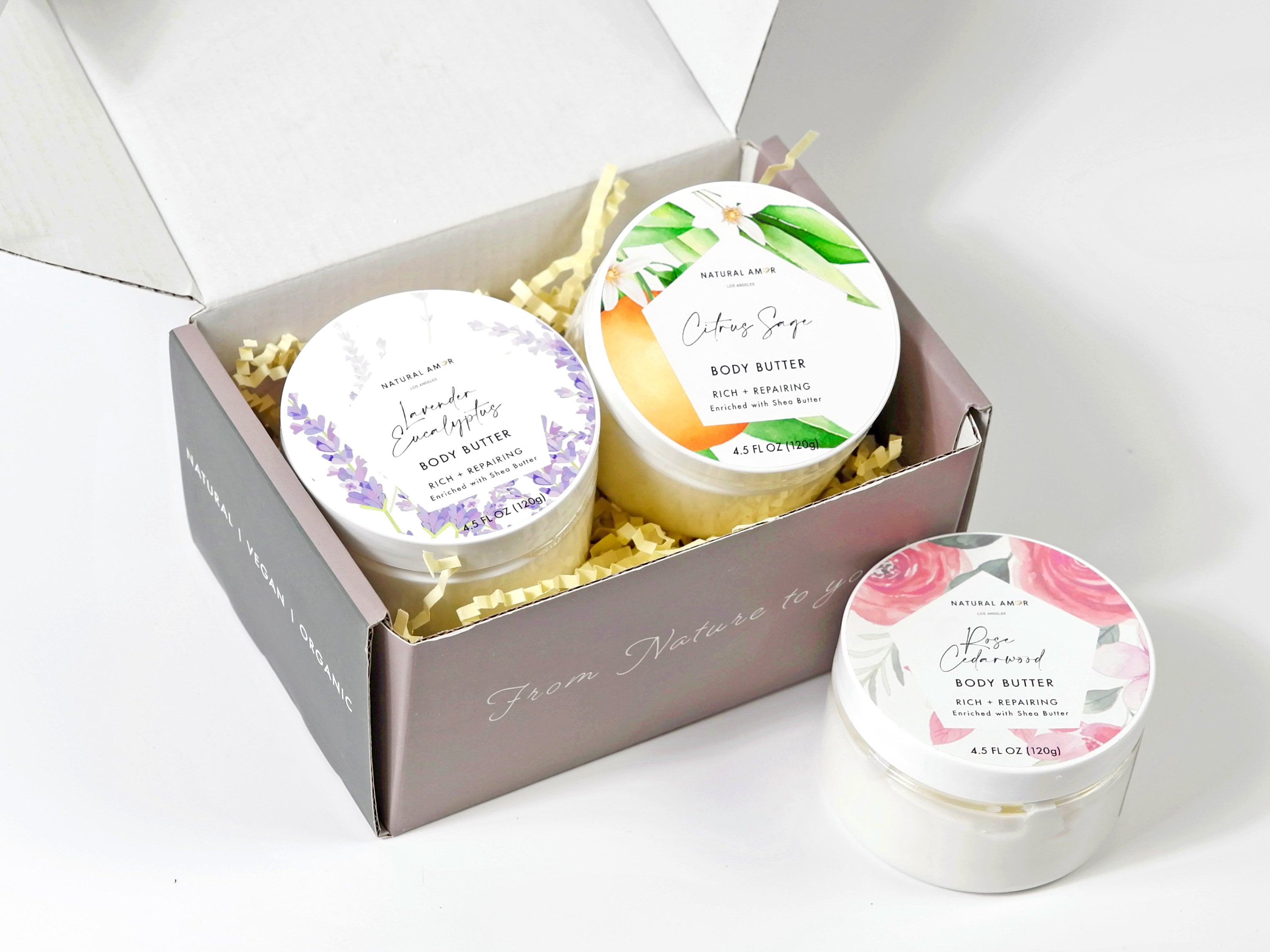 Body Butter Trio Gift Set featuring three 4oz jars in a beautifully designed gift box, showcasing Lavender Eucalyptus, Citrus Sage, and Rose Cedarwood scents.