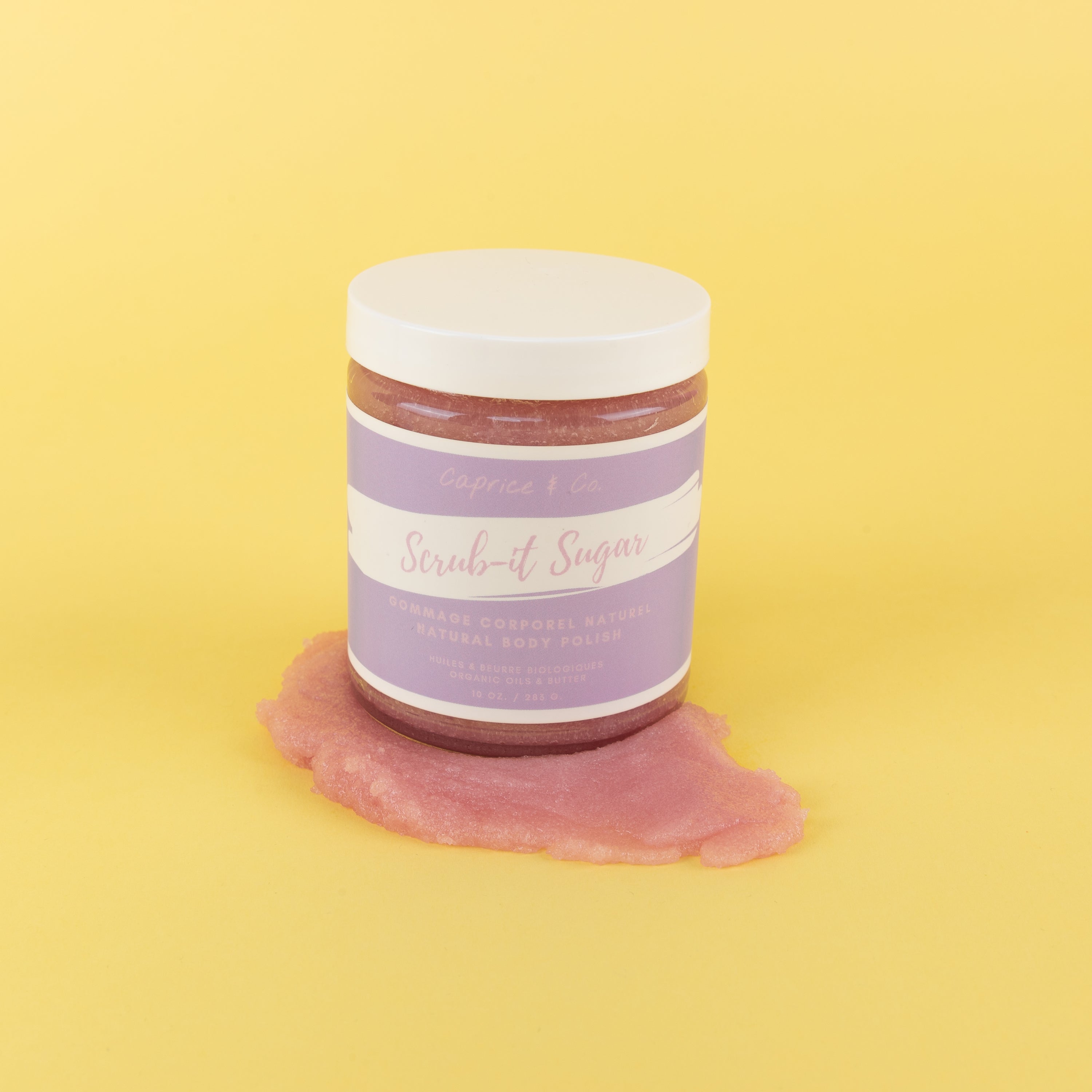 A vibrant pink jar of Bubblegum Body Scrub with a label, showcasing its natural ingredients and sweet scent.