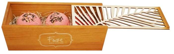 Bomb Cores gift box featuring three colorful bath bombs and a soap ball, elegantly packaged in a handcrafted wooden box.