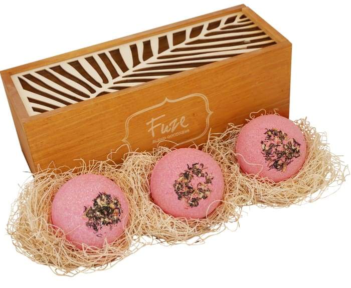 Bomb Cores gift box featuring three colorful bath bombs and a soap ball, elegantly packaged in a handcrafted wooden box.