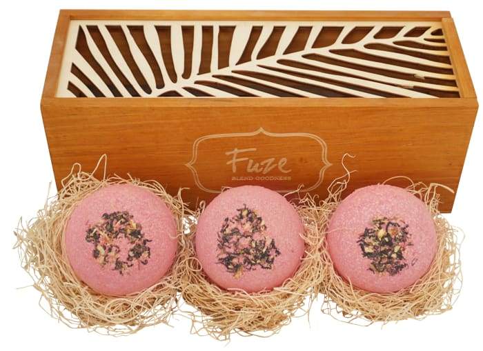 Bomb Cores gift box featuring three colorful bath bombs and a soap ball, elegantly packaged in a handcrafted wooden box.