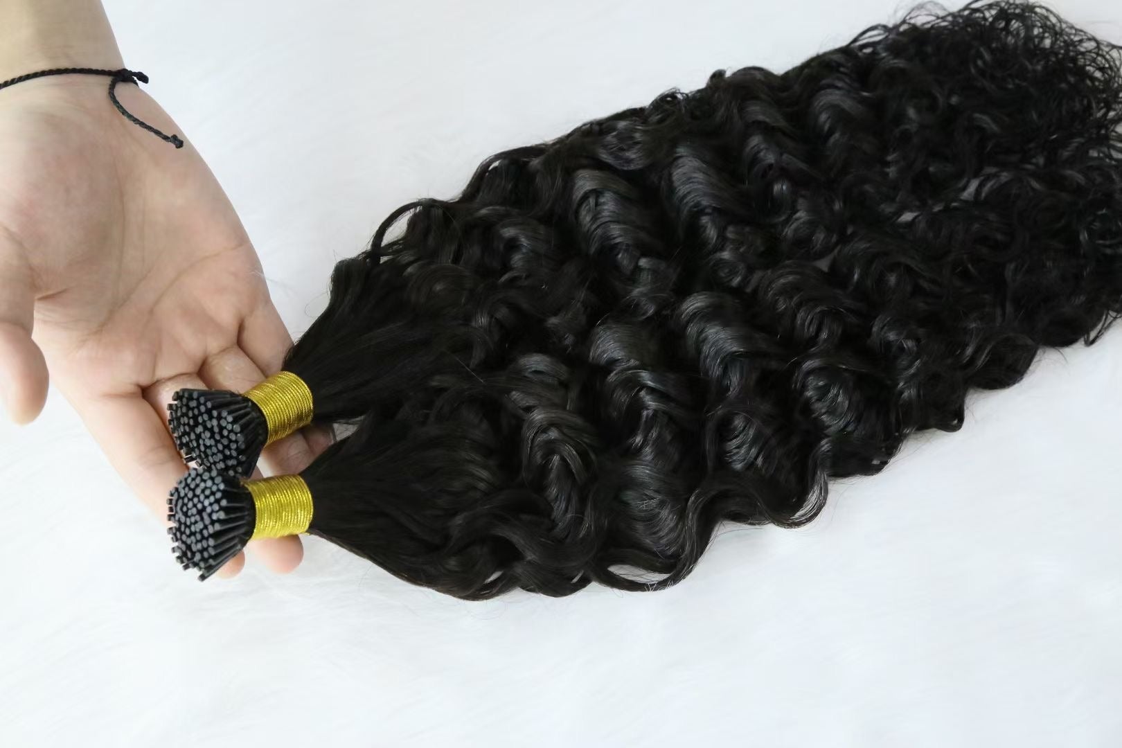 Brazilian Deep Wave Human Hair i Tip Microlinks in natural black color, showcasing deep wave texture and bulk braiding options.