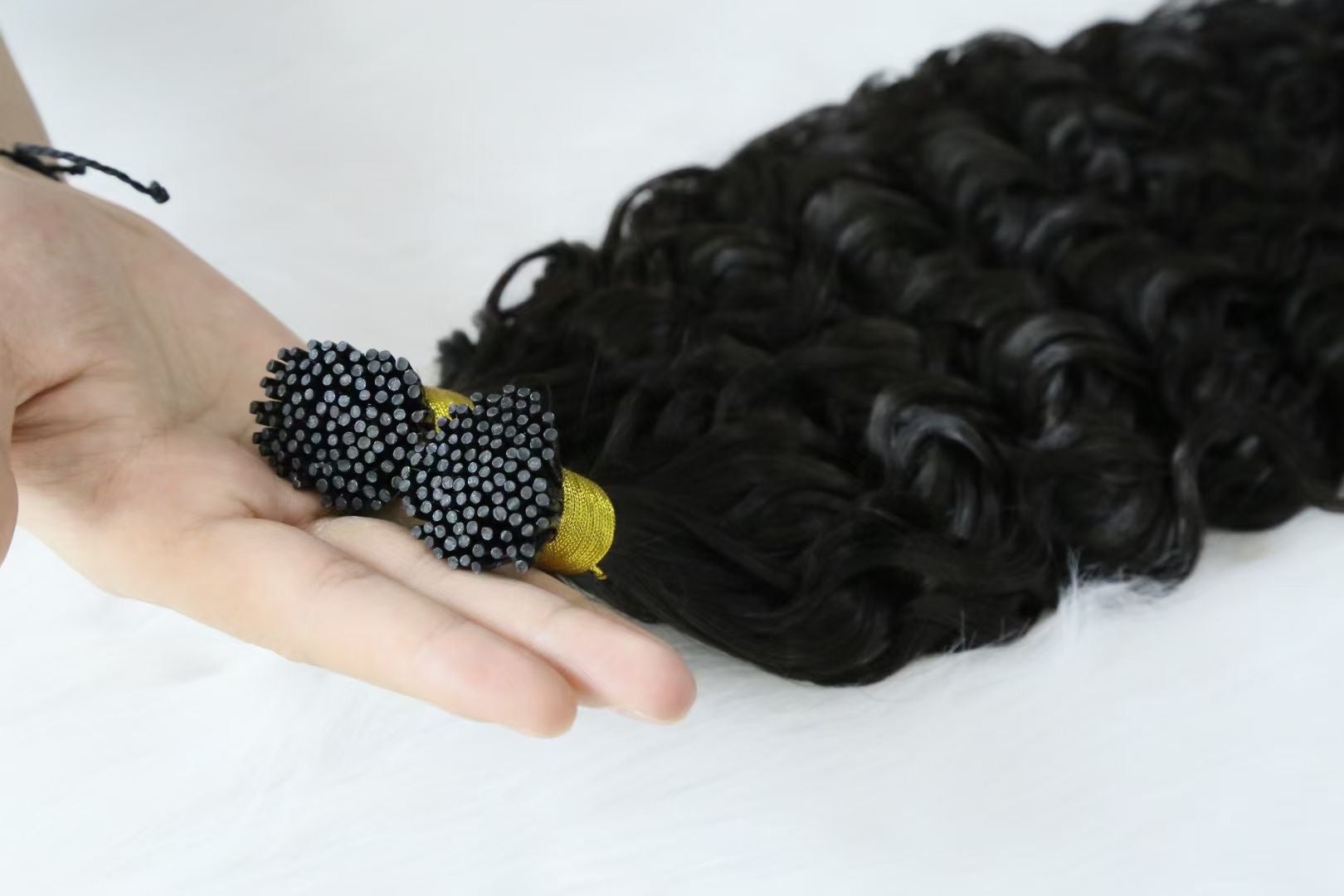 Brazilian Deep Wave Human Hair i Tip Microlinks in natural black color, showcasing deep wave texture and bulk braiding options.