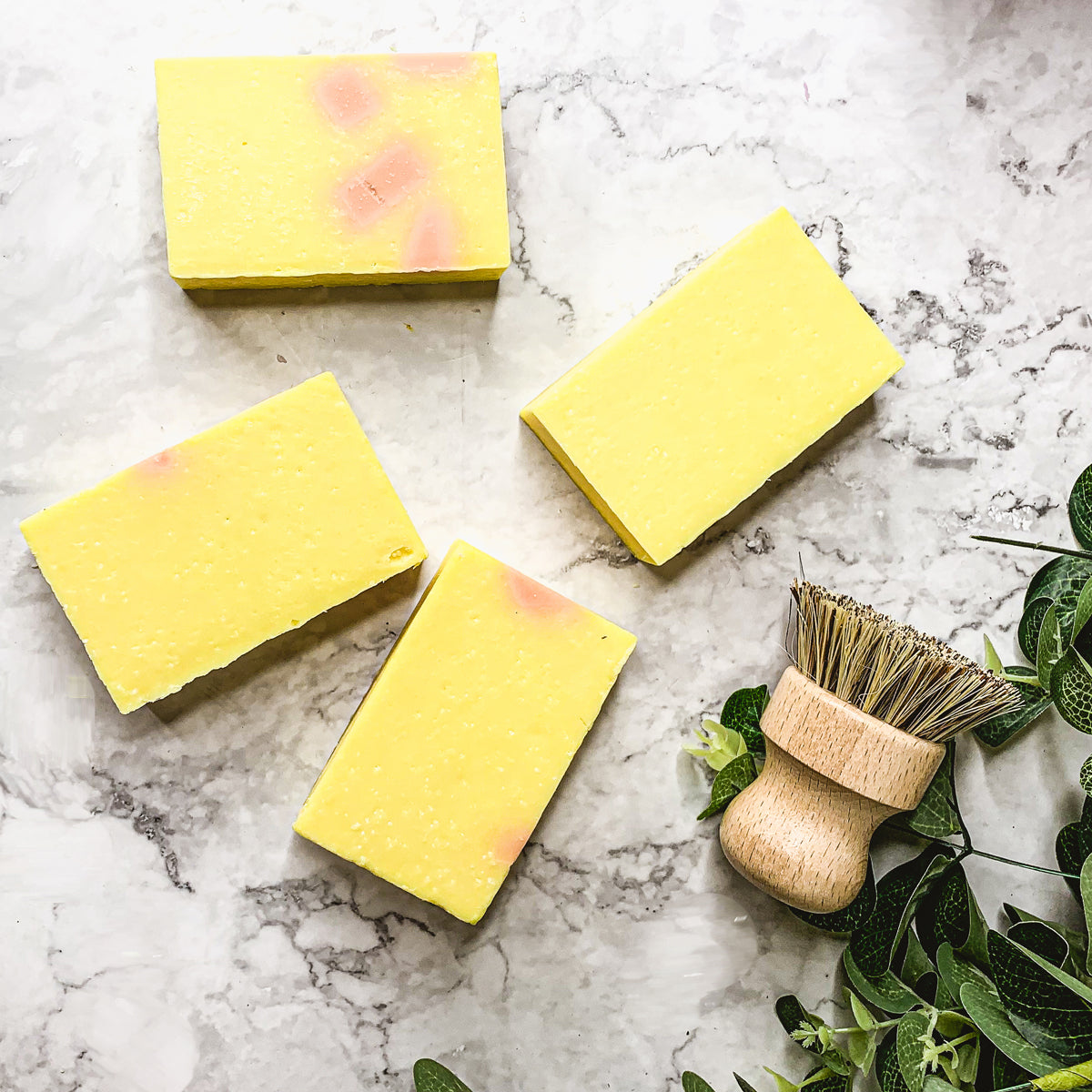 Bromelain Rose Hips soap bar with vibrant colors and a citrus scent, showcasing its handcrafted design and natural ingredients.