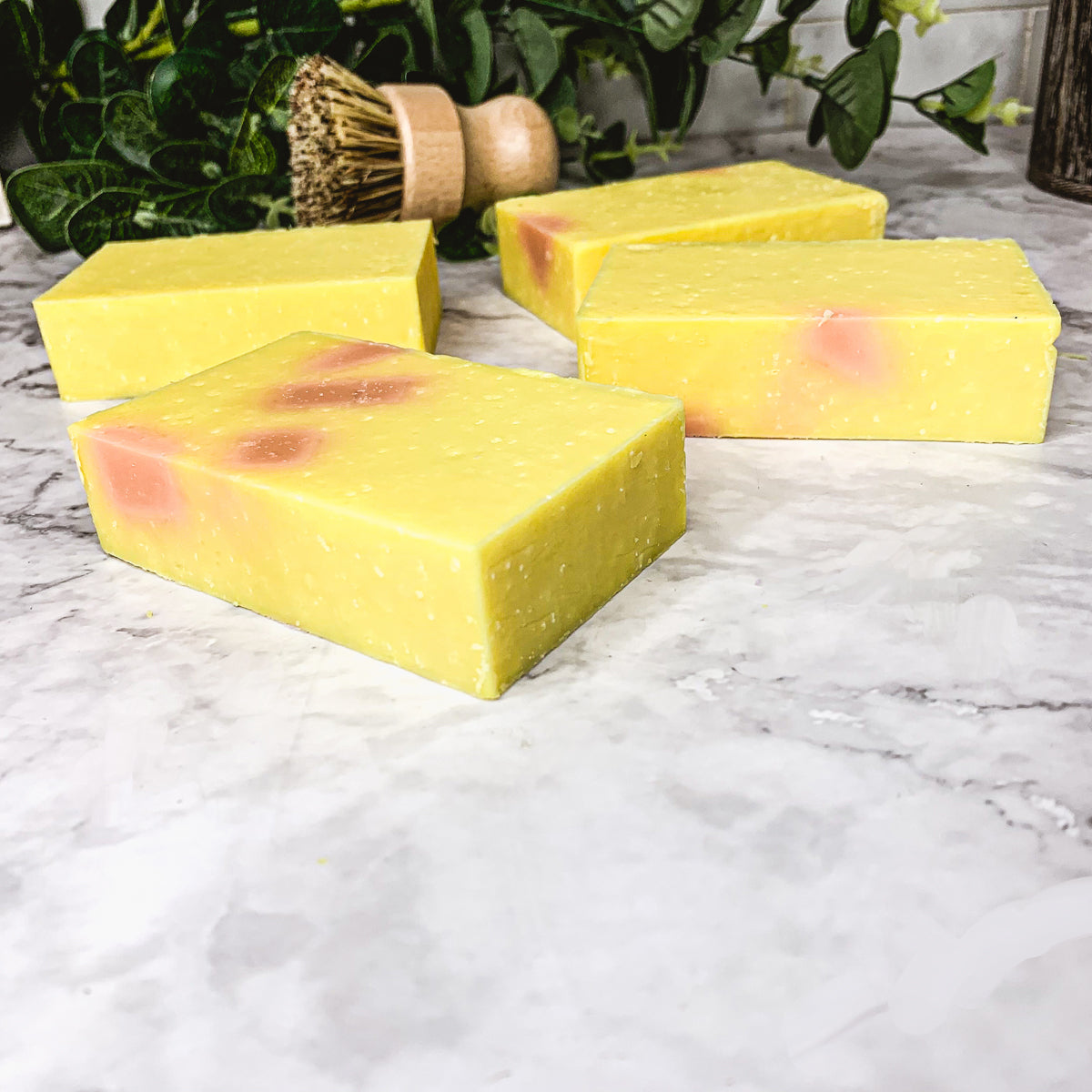 Bromelain Rose Hips soap bar with vibrant colors and a citrus scent, showcasing its handcrafted design and natural ingredients.