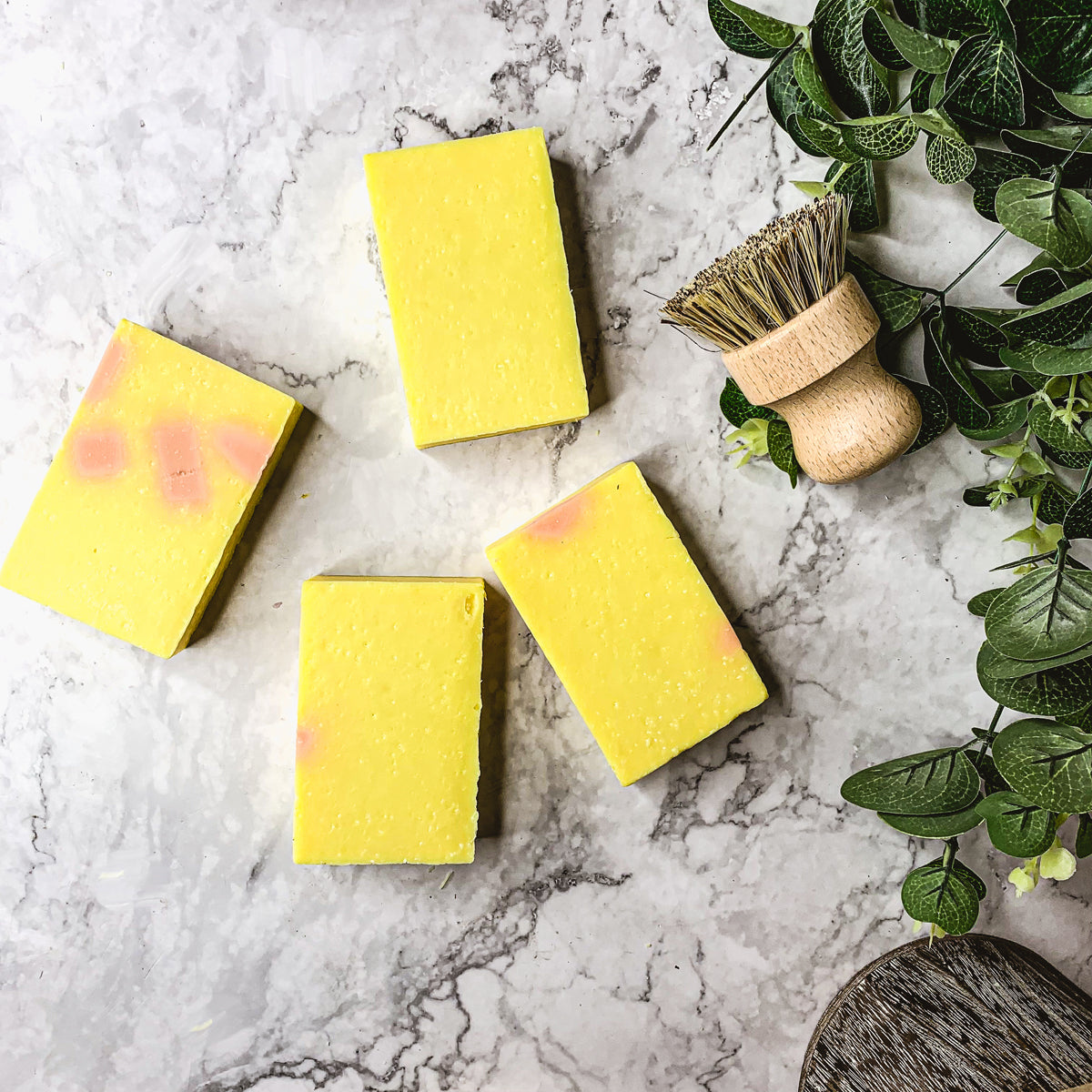 Bromelain Rose Hips soap bar with vibrant colors and a citrus scent, showcasing its handcrafted design and natural ingredients.