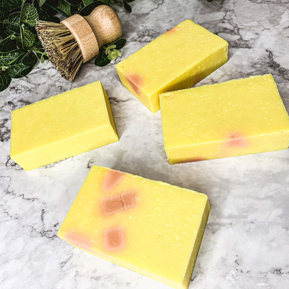 Bromelain Rose Hips soap bar with vibrant colors and a citrus scent, showcasing its handcrafted design and natural ingredients.