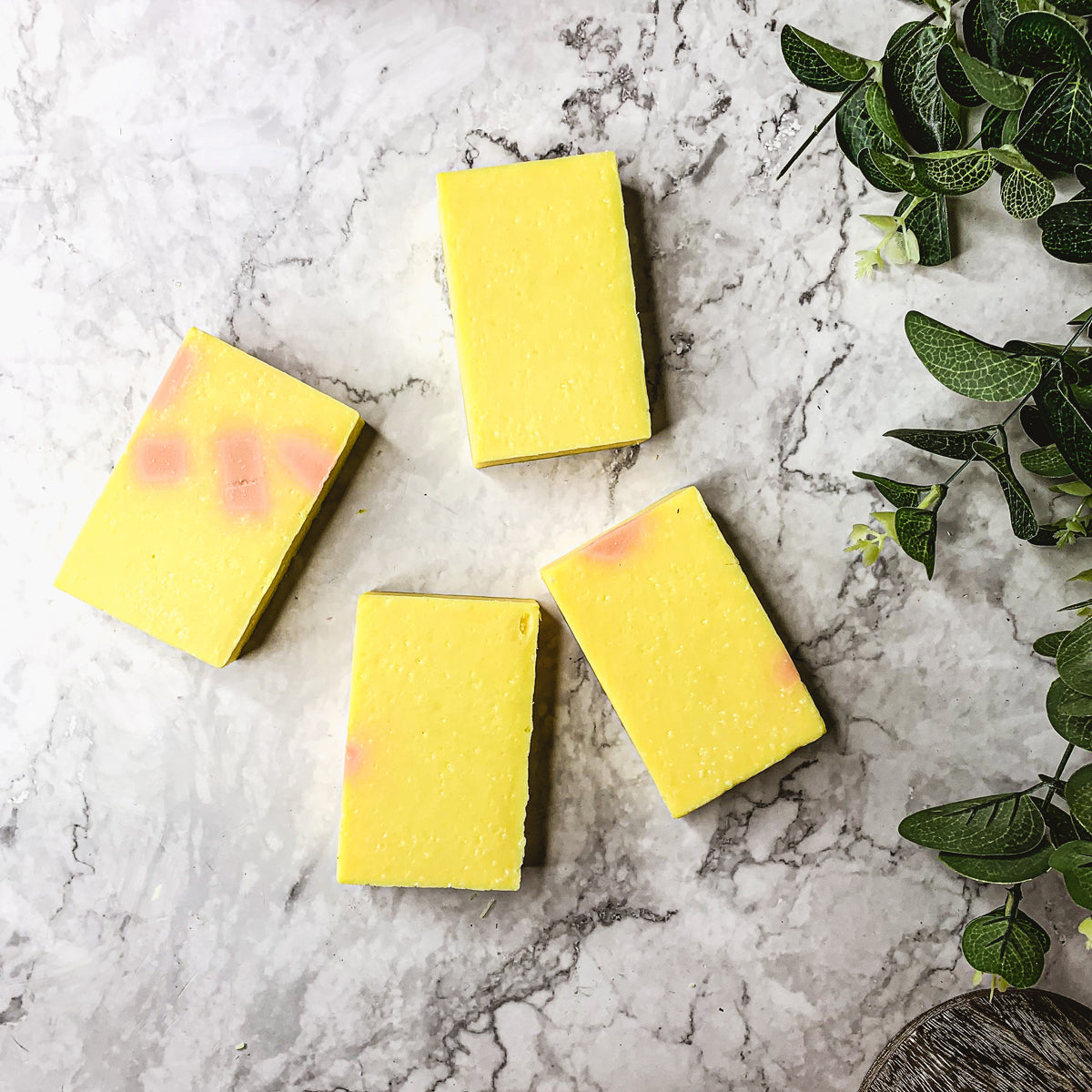 Bromelain Rose Hips soap bar with vibrant colors and a citrus scent, showcasing its handcrafted design and natural ingredients.