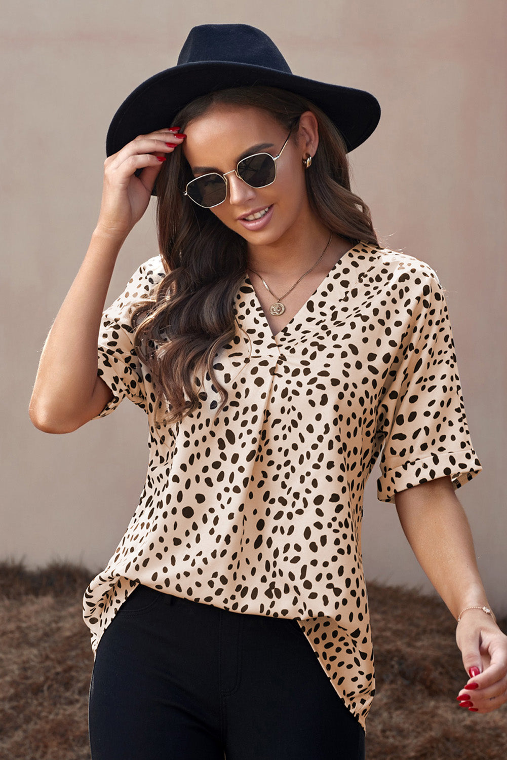 Brown animal print V-neck tunic top with rolled sleeves, showcasing a stylish design and comfortable fit.