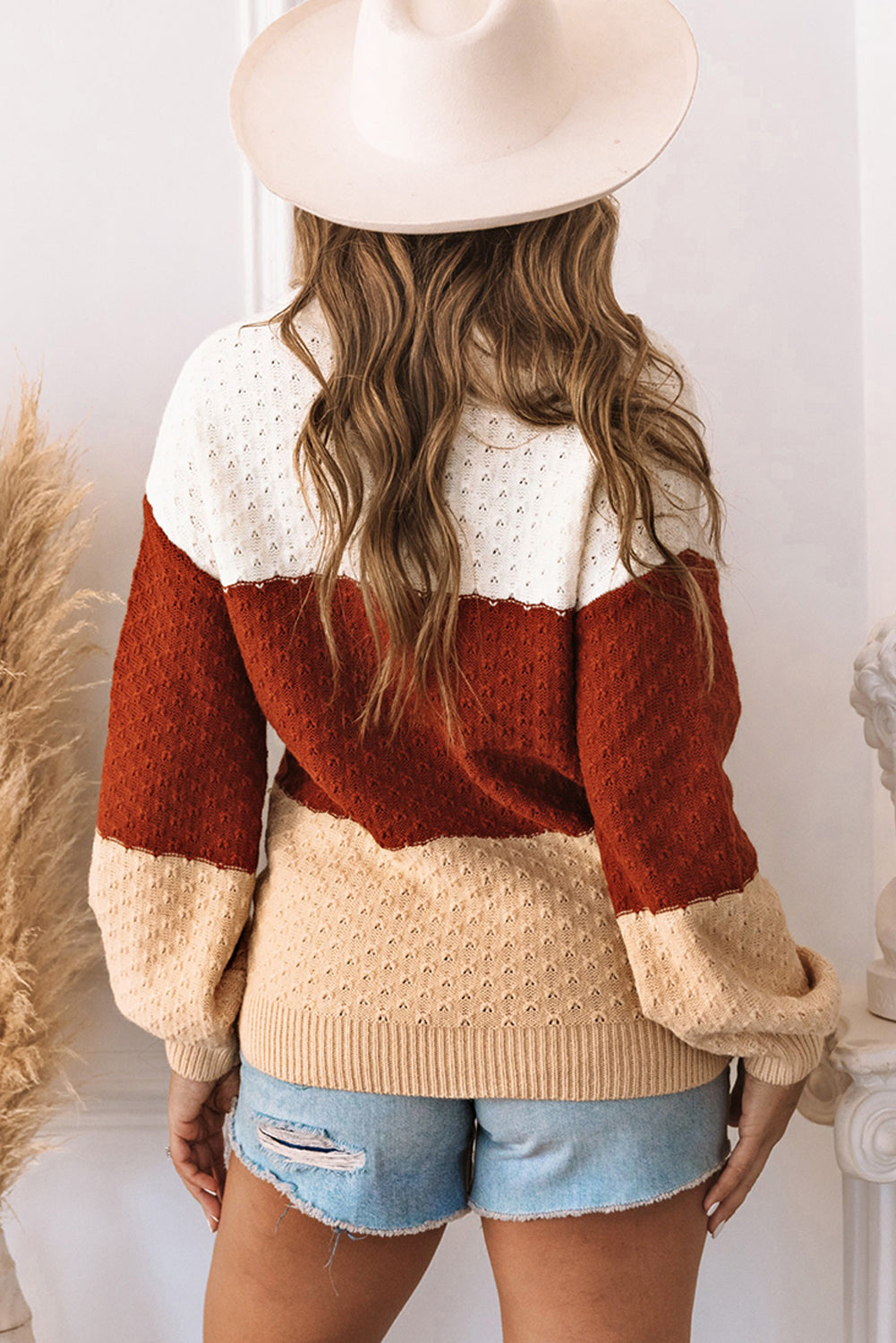 A stylish brown geometric texture colorblock sweater featuring a unique design, perfect for winter wear.