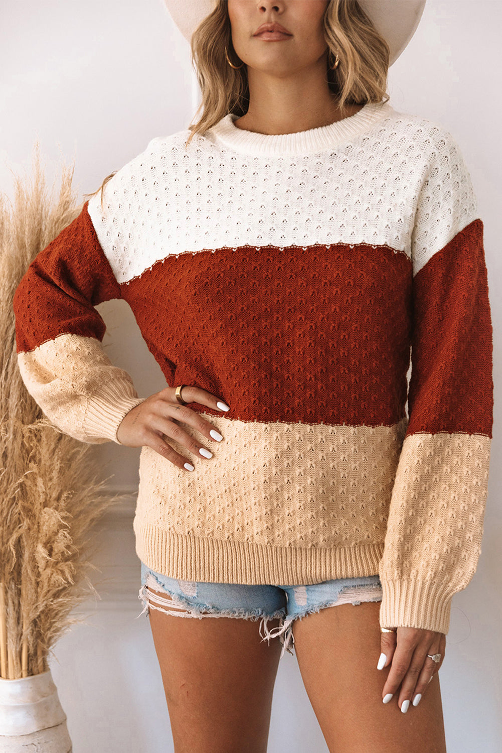 A stylish brown geometric texture colorblock sweater featuring a unique design, perfect for winter wear.