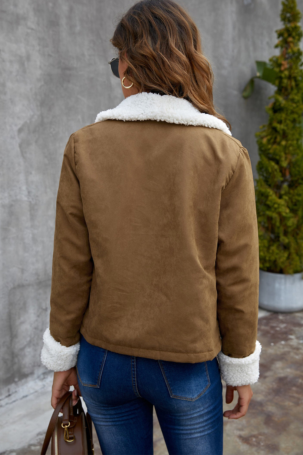 Brown lapel collar fleece open front coat displayed on a mannequin, showcasing its stylish design and warm fleece lining.