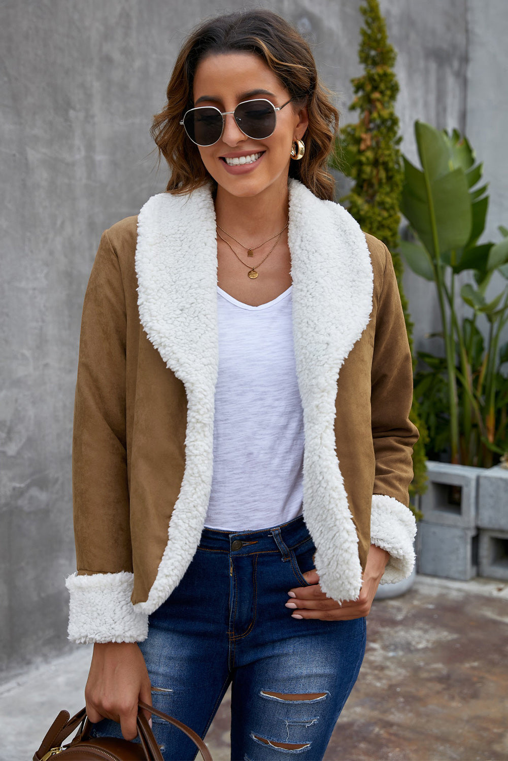 Brown lapel collar fleece open front coat displayed on a mannequin, showcasing its stylish design and warm fleece lining.