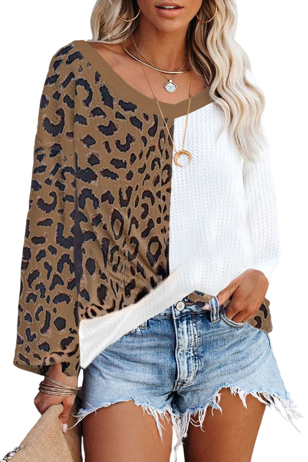 Brown leopard print contrast waffle knit top with twist hem and v-neck design, showcasing a stylish and cozy look.