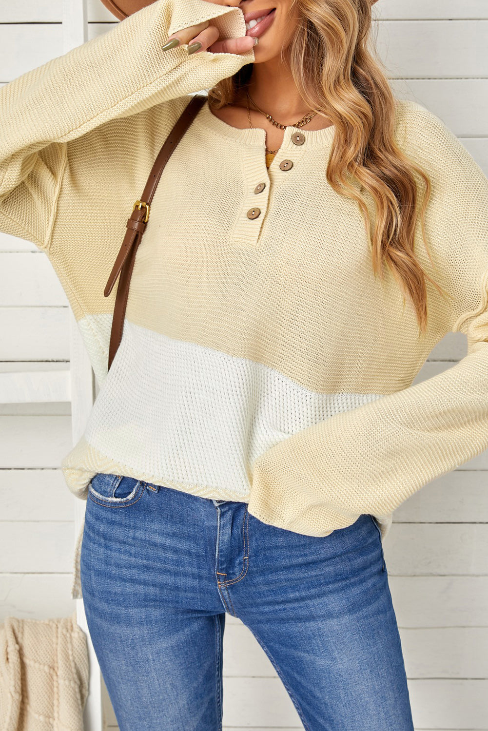 A stylish brown knitted long sleeve sweater featuring color splicing and buttoned design, perfect for casual outfits.