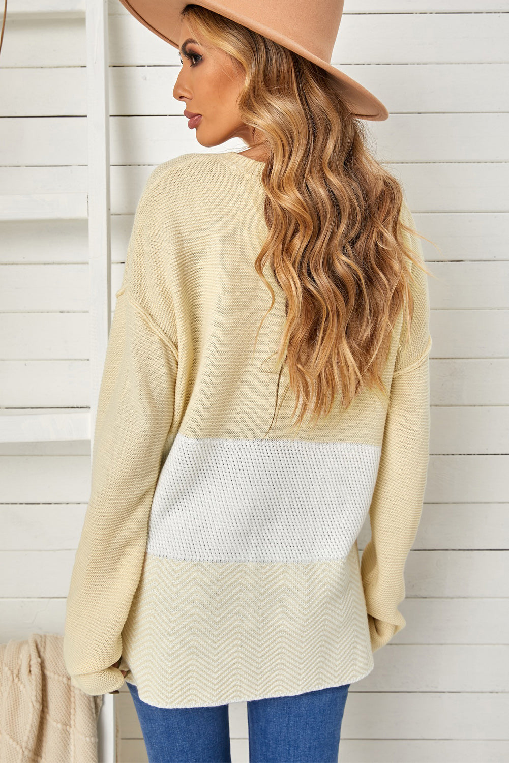 A stylish brown knitted long sleeve sweater featuring color splicing and buttoned design, perfect for casual outfits.