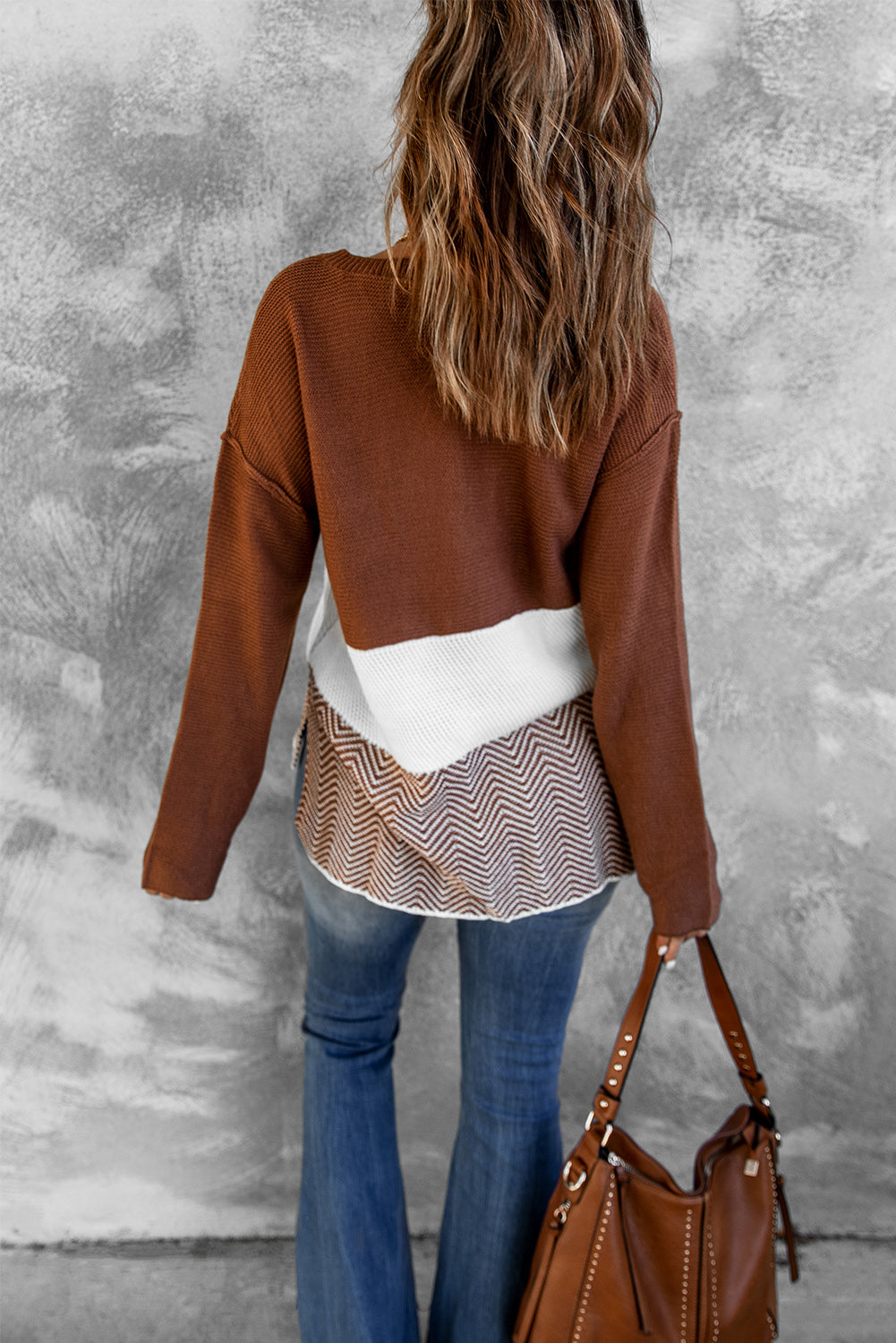 A stylish brown knitted long sleeve sweater featuring color splicing and buttoned design, perfect for casual outfits.