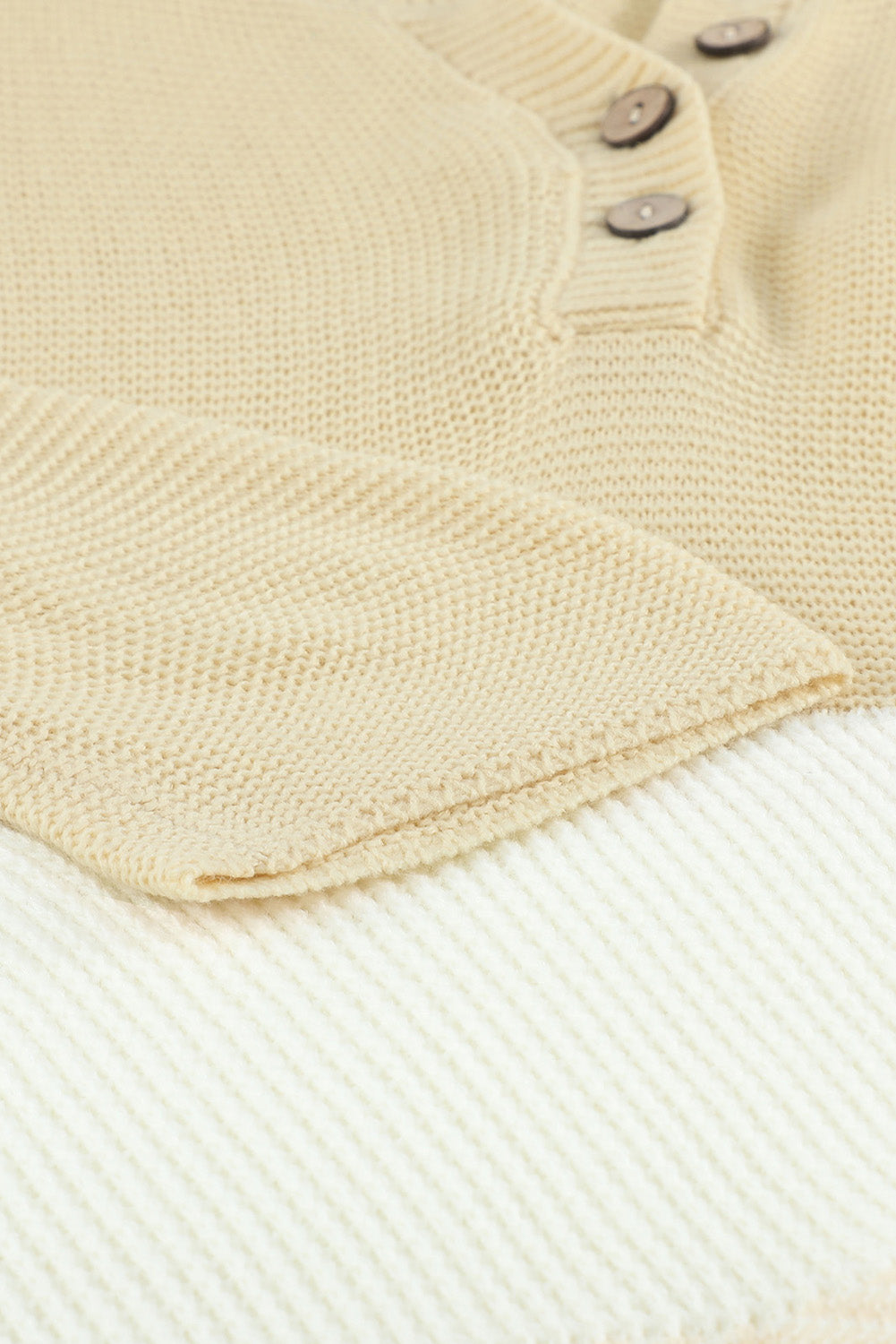 A stylish brown knitted long sleeve sweater featuring color splicing and buttoned design, perfect for casual outfits.