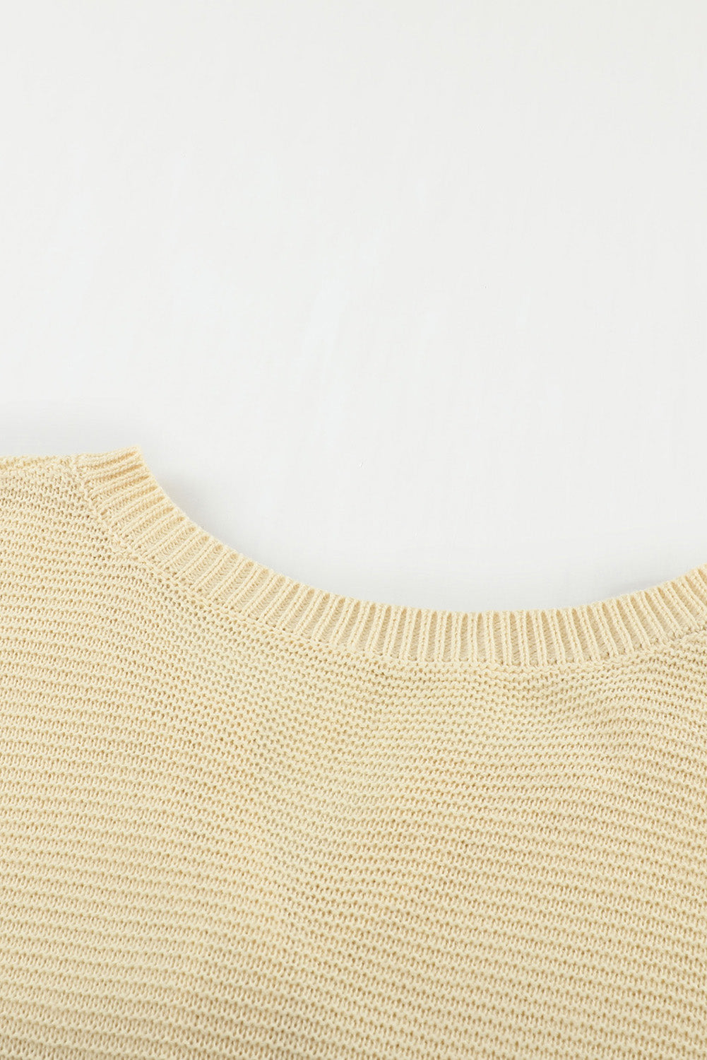 A stylish brown knitted long sleeve sweater featuring color splicing and buttoned design, perfect for casual outfits.