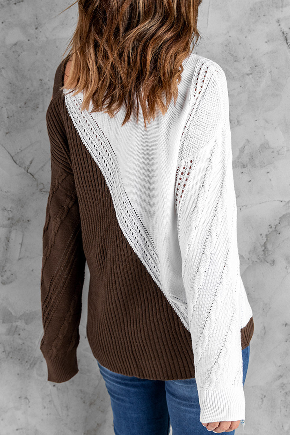 A stylish brown turtleneck sweater featuring cold shoulder design and buckled decor, perfect for chic and cozy looks.