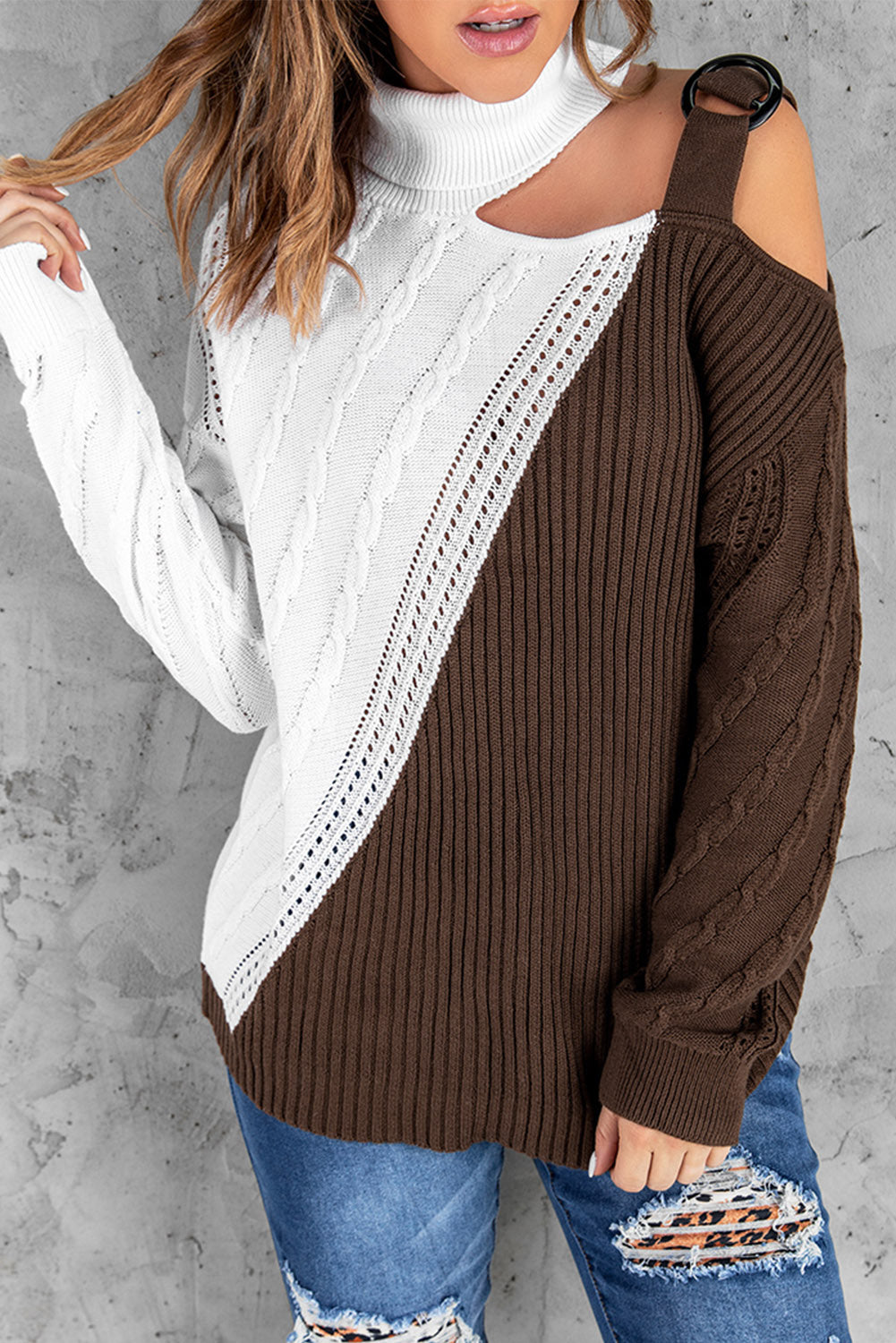 A stylish brown turtleneck sweater featuring cold shoulder design and buckled decor, perfect for chic and cozy looks.