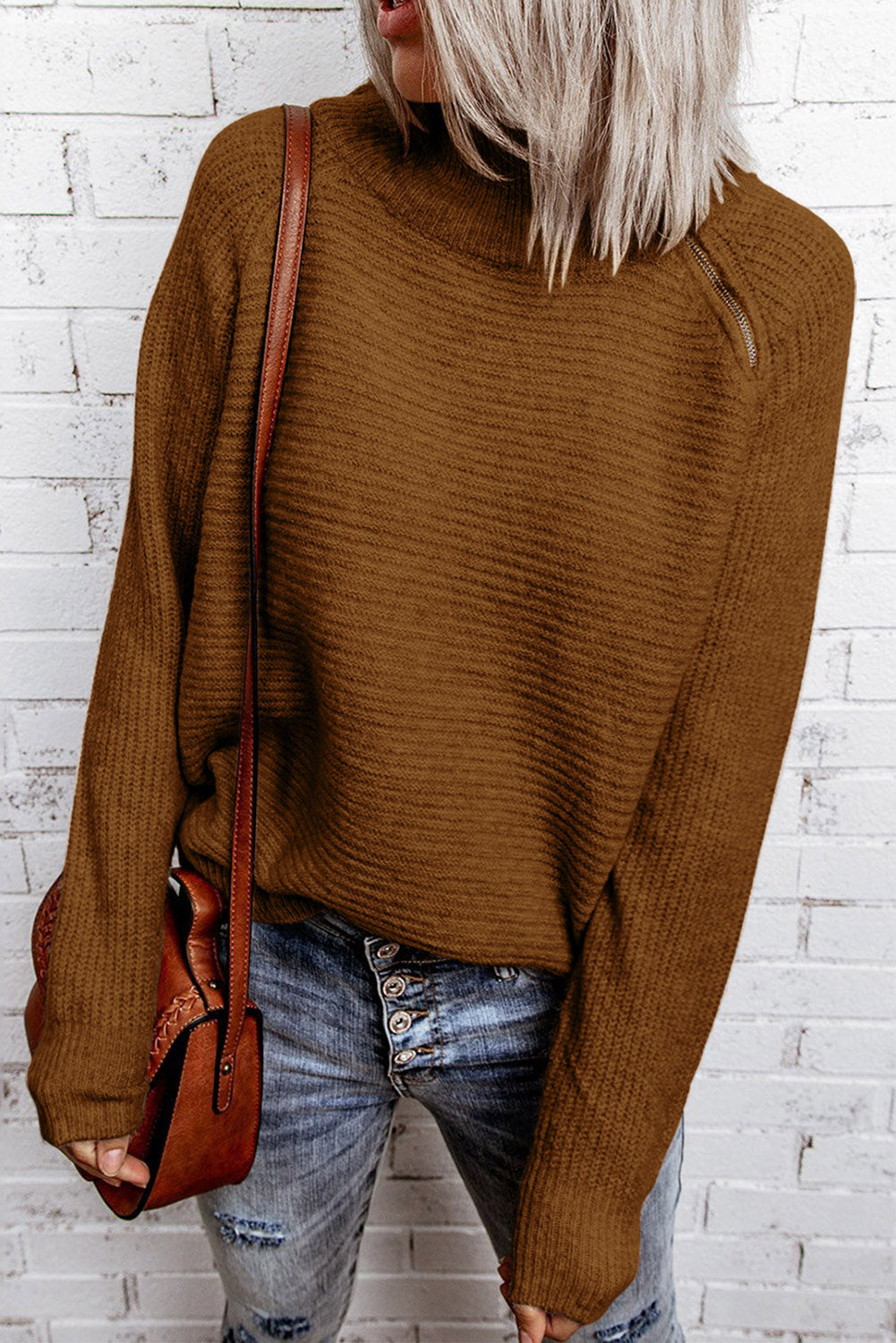 A stylish brown zip knitted high neck sweater displayed on a mannequin, showcasing its soft texture and modern design.