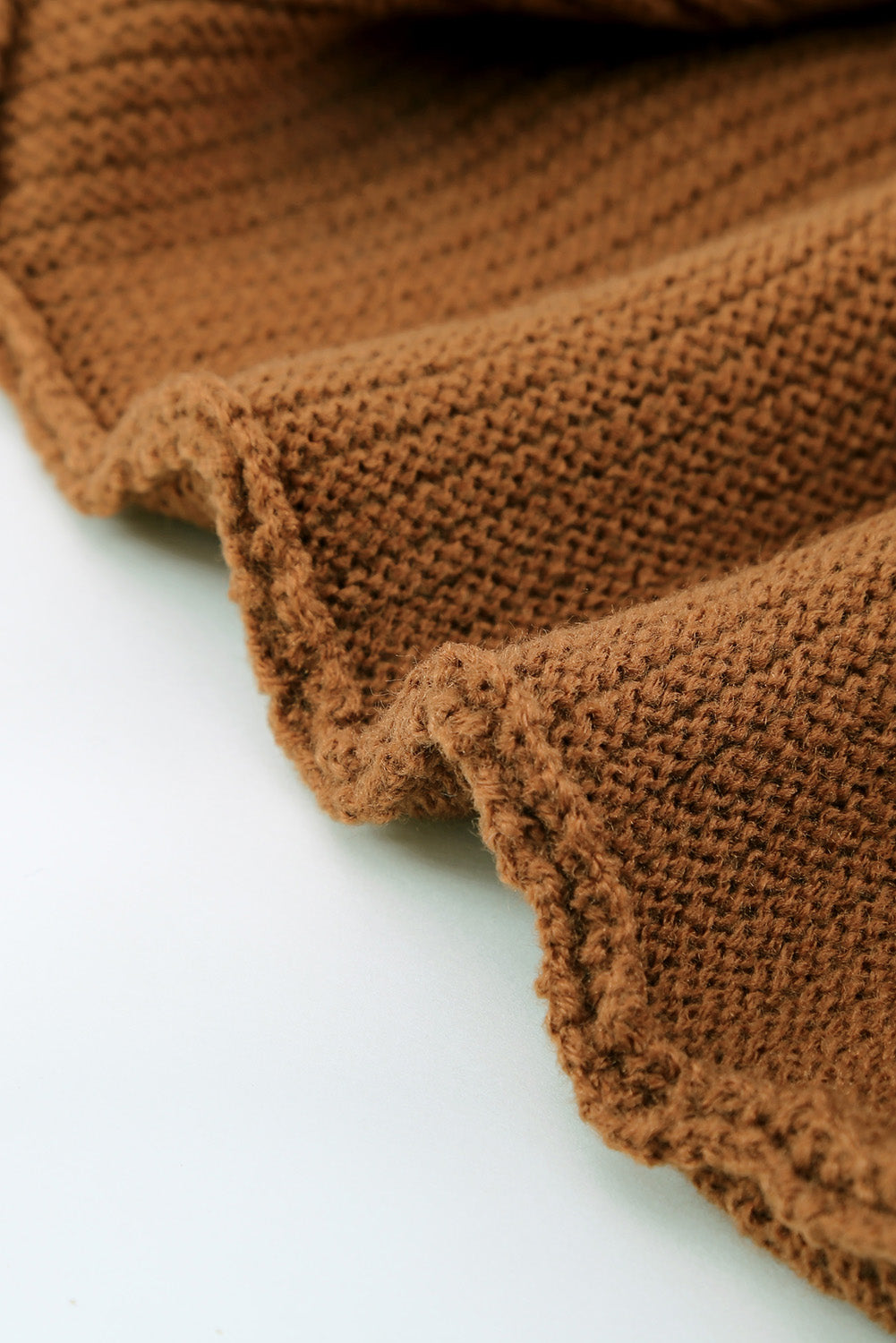 A stylish brown zip knitted high neck sweater displayed on a mannequin, showcasing its soft texture and modern design.