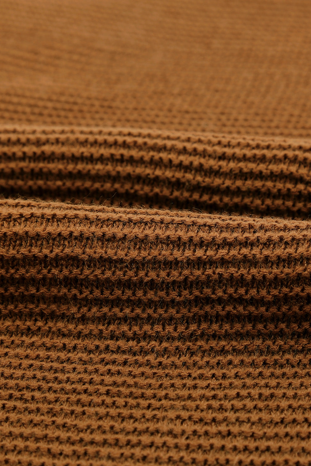 A stylish brown zip knitted high neck sweater displayed on a mannequin, showcasing its soft texture and modern design.