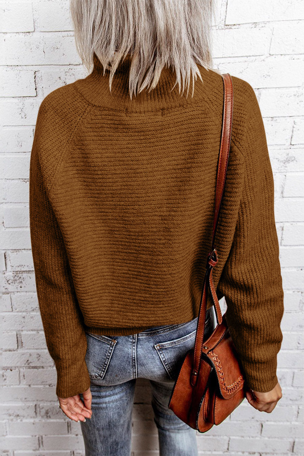 A stylish brown zip knitted high neck sweater displayed on a mannequin, showcasing its soft texture and modern design.